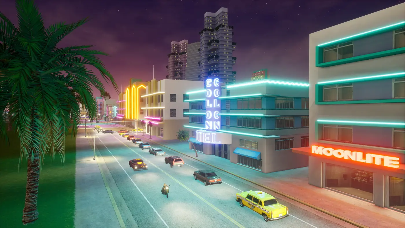 An Art Deco Vice City street at night, blue neon of the Colonn hotel and a pink Moonlite sign, palm trees and a yellow taxi, in GTA Vice City Definitive Edition