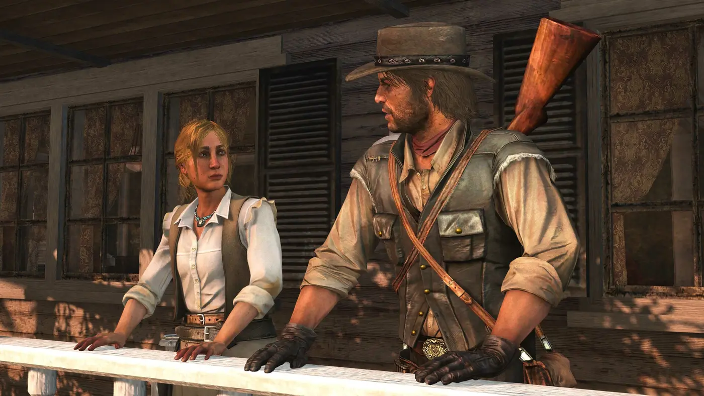 John Marston, hat on and rifle slung across his back, talking with a blonde rancher leaning on the railing of a ranch in Red Dead Redemption