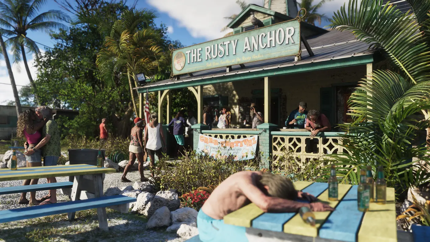 The Rusty Anchor beach bar in GTA VI's Leonida Keys, customers in swimsuits under the veranda, a man sunbathing stretched out on a picnic table