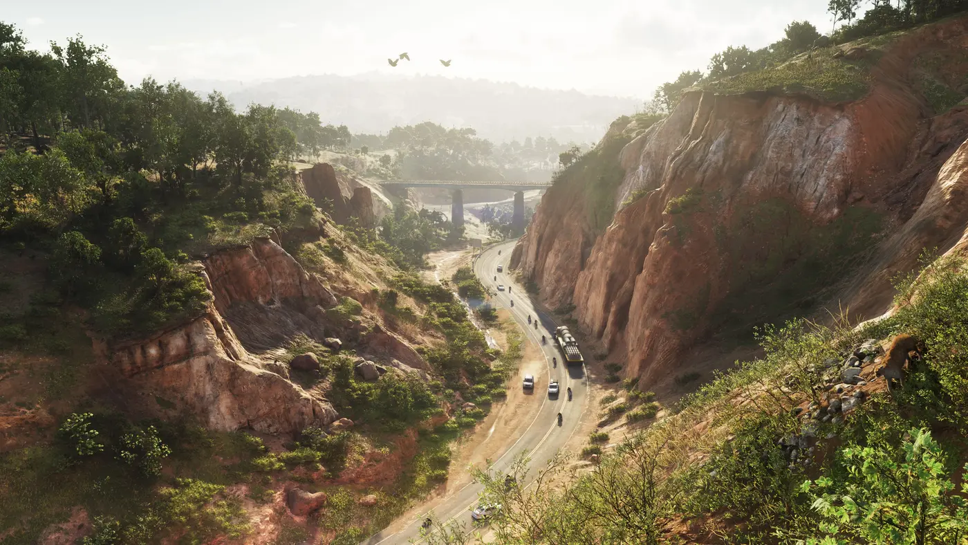 A red-cliffed canyon in the Leonida backcountry in GTA VI, a winding road at the bottom of the gorge traveled by cars, motorcycles and a semi truck, a bridge spanning the ravine